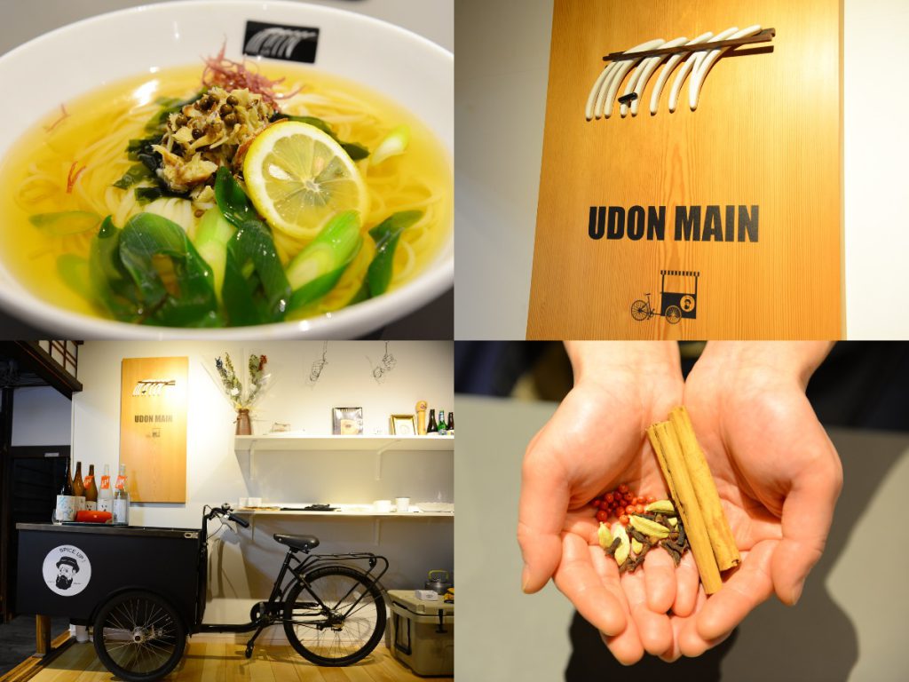 UDON MAINの店舗写真。提供されるうどん、看板、自転車を改造した黒色のリヤカー、両手の平にオリジナルスパイスがのせられています。