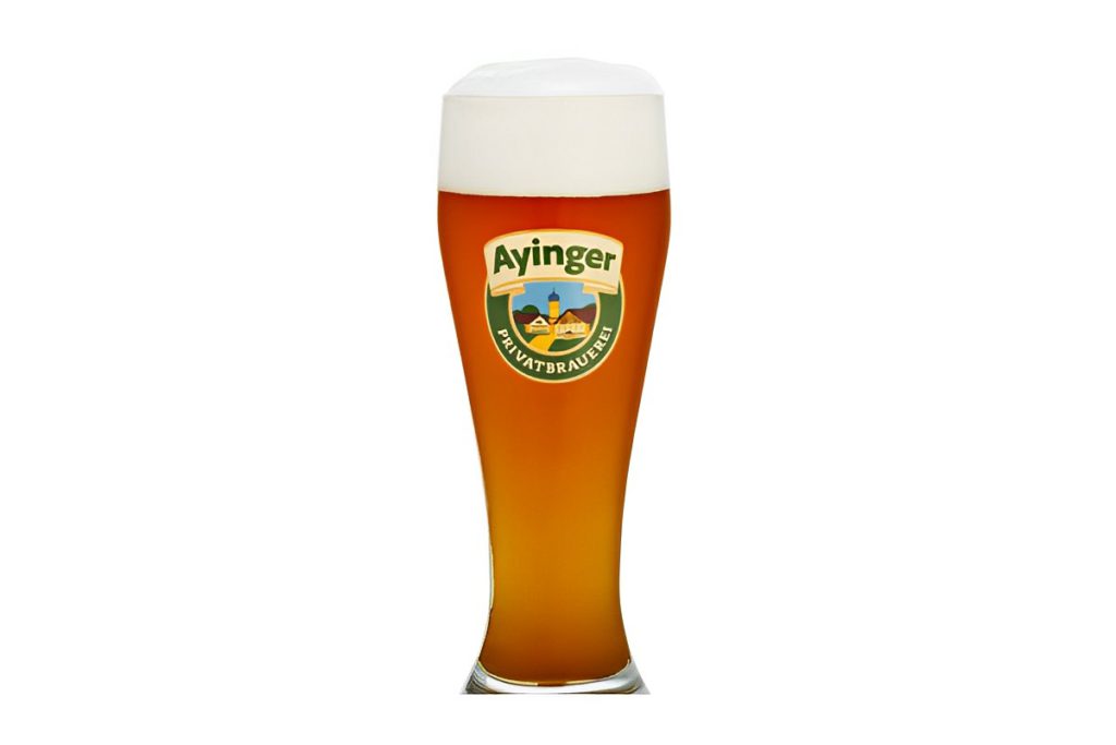 Chilled golden beer poured into a tall glass