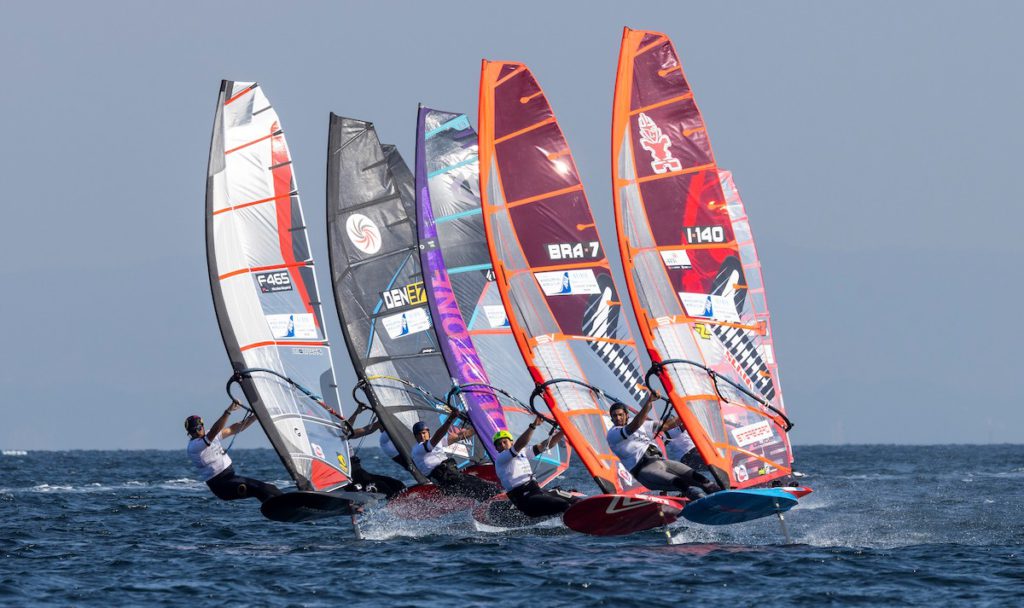 Five competitors racing across the sea in the Windsurfing World Cup